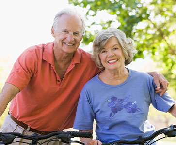 Photo of a man and woman smiling for a picture. Link to Life Stage Gift Planner Ages 45-65 Situations.